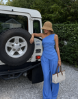 blue Striped off the shoulder top
Asymmetrical hem
Twisted strap
Side zipper
Unlined
hamptons east coast outfit