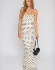 Polka dot printed maxi dress
Tube top
Ruffle on bust trim
Asymmetric ruffle detail on bottom half
Back cut out
Inner rubber grip lining
Side zipper closure
Lined
cream and black polka dot dress
bridal maxi dress