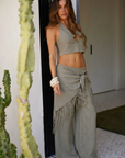 TOP
green Cropped halter top
Adjustable neck tie
Side zipper closure
Front keyhole with bead detail

resort outfit

BOTTOM
green Elastic waistband
Comes with hip scarf
