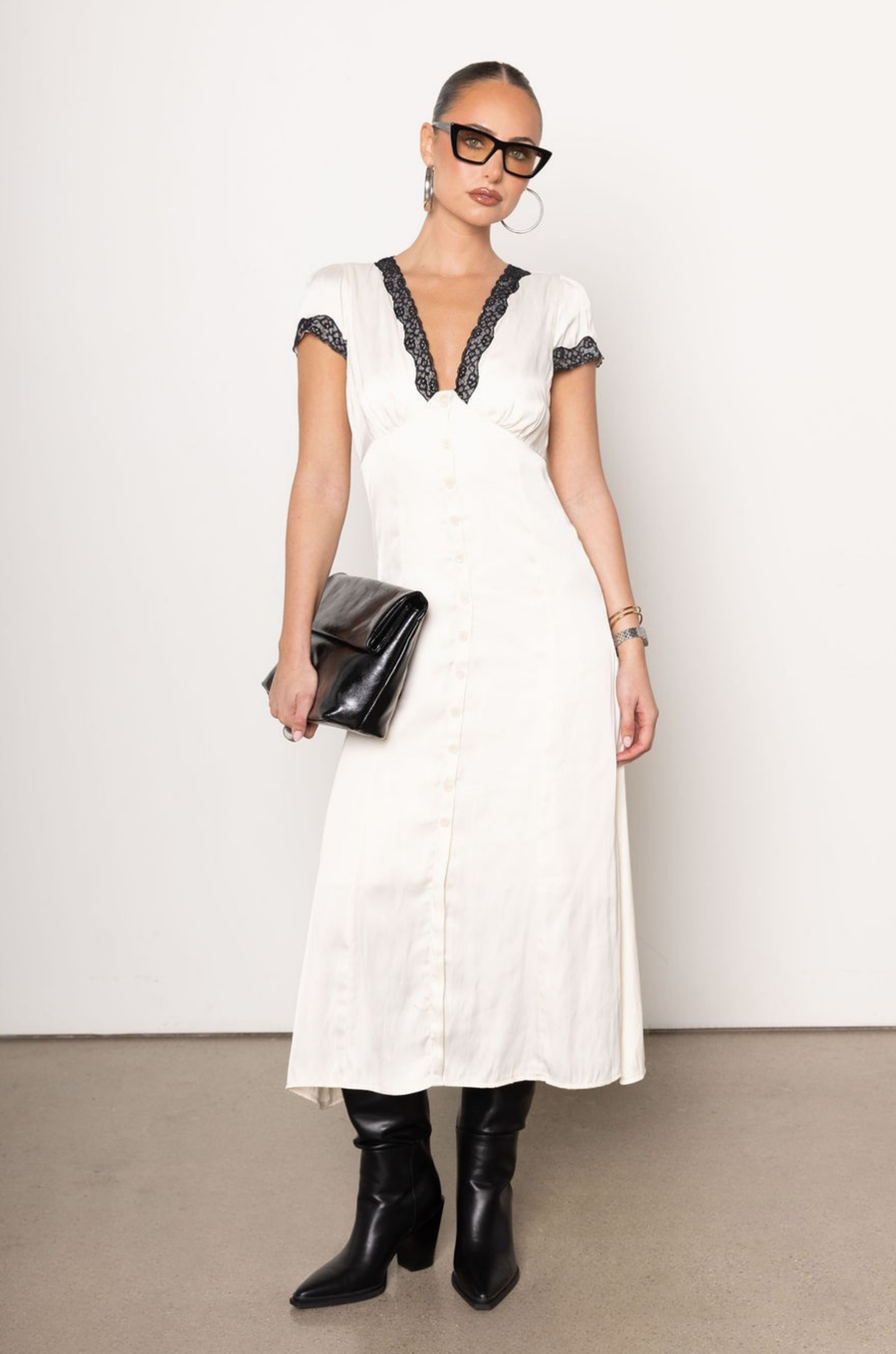 ivory Satin midi dress
Contrast lace trim
Short sleeve
V-neckine
Button down closure
Lined
Length: 45"
Polyester
white satin midi dress
vintage midi dress
fall outfit
fall dress
bridal dress