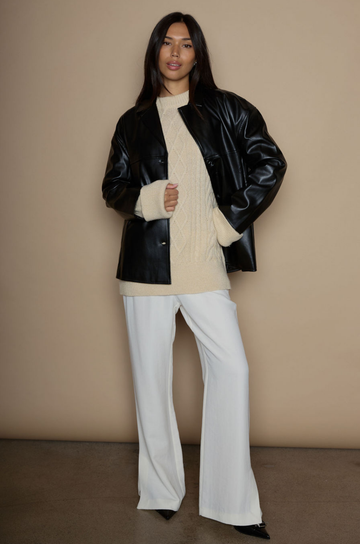 Faux leather blazer. faux leather jacket. Single breast. Collar neckline. Front button down closure. Side pockets. Back slit. Fully lined. black leather jacket. black leather blazer. fall jacket. trendy fall jacket. winter jacket. trendy winter jacket