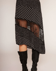 Polka dot asymmetrical skirt
Asymmetrical hem
Lace panel
Side zipper closure
Unlined
black and white polka dot asymmetrical midi skit with a lace panel