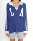 Raglan Rugby Long Sleeve
Featuring a shoutout to Los Angeles across the chest
Star detailed sleeves
Oversized fit
Collar and placket
Blue LA long sleeve top
Dodgers top