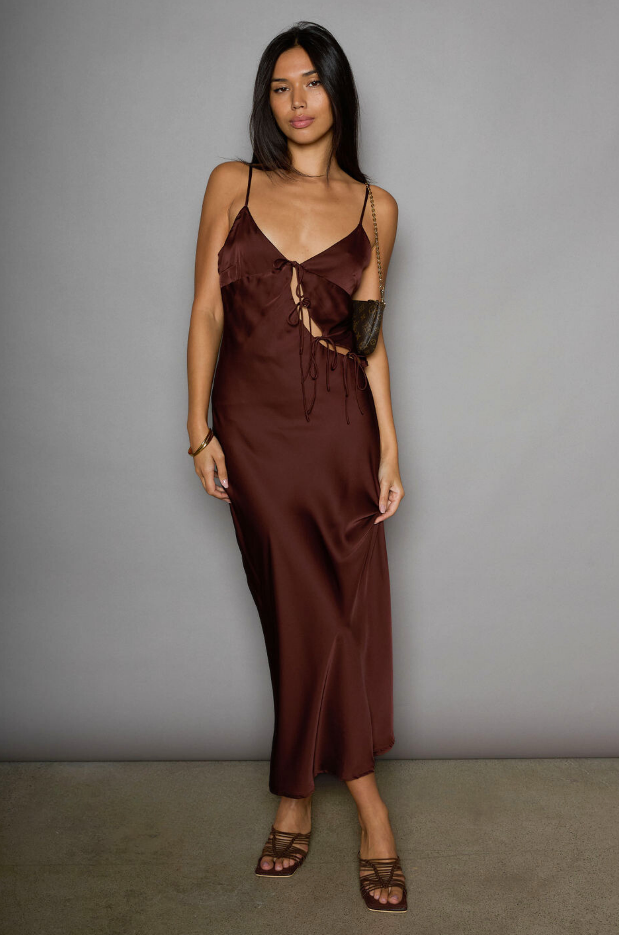 Satin maxi dress. Adjustable straps. Front tie closures. Side hook and eye and zipper closures. Unlined. brown satin midi dress. brown maxi satin dress. fall dress. fall wedding guest dress