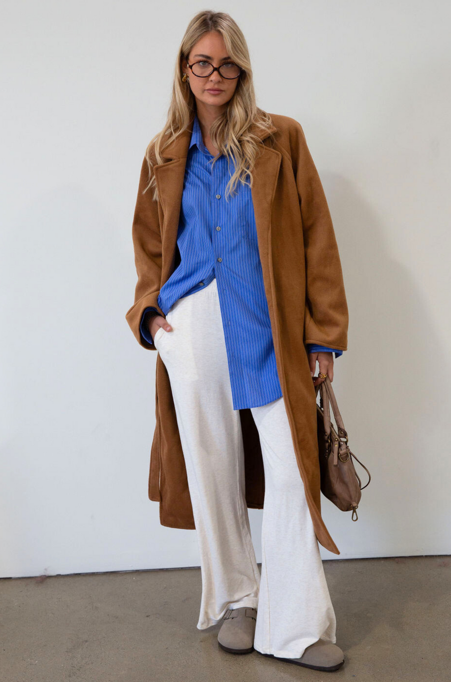 Ribbed knit pants. Elastic waistband. Side pockets. Unlined. causal pant. fall pant. cream casual pant