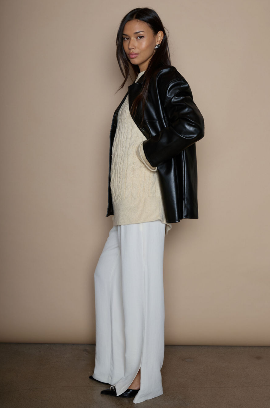 Faux leather blazer. faux leather jacket. Single breast. Collar neckline. Front button down closure. Side pockets. Back slit. Fully lined. black leather jacket. black leather blazer. fall jacket. trendy fall jacket. winter jacket. trendy winter jacket
