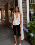 white Open crochet halter top
Adjustable neck tie
Unlined/Sheer
Can also be worn as a skirt
Waist: 28" / Length: 16.5"
Cotton