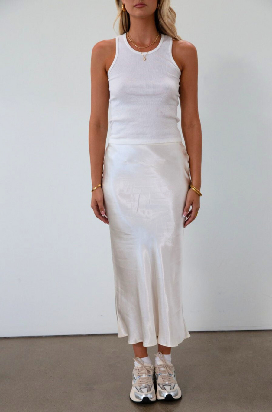 Satin maxi skirt. Elastic waist. Side hook and eye and zipper closures. Unlined. cream maxi skirt. satin maxi skirt. fall outfit. 