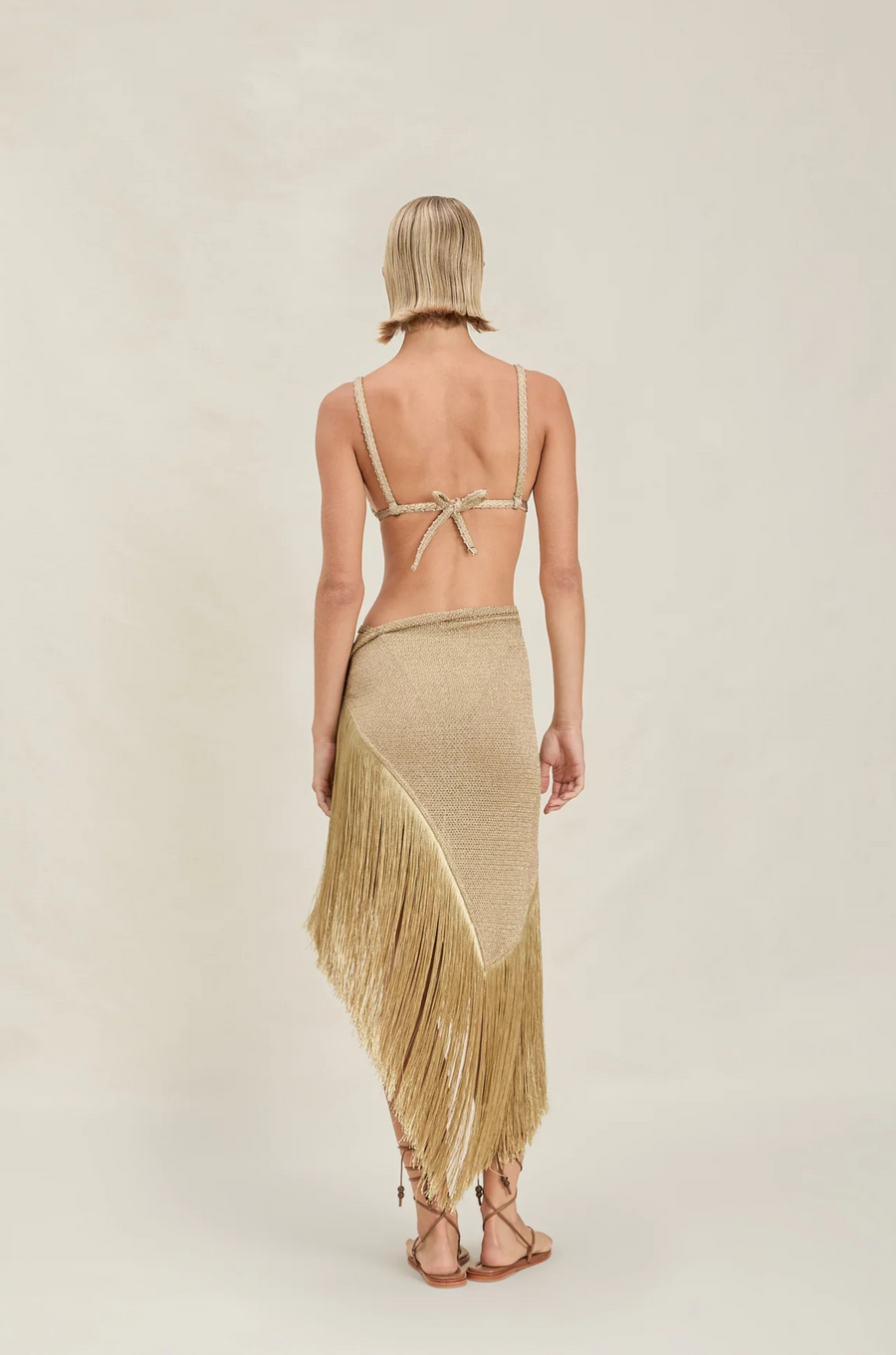 Shimmer metallic sarong skirt
Fringe detailing at hem
Can also convert into a top
gold shimmer cover up skirt
gold sarong