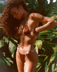 The perfect skimpy cut bikini bottom.
Sleek Italian nylon meets artisanal beading.
Side beading.