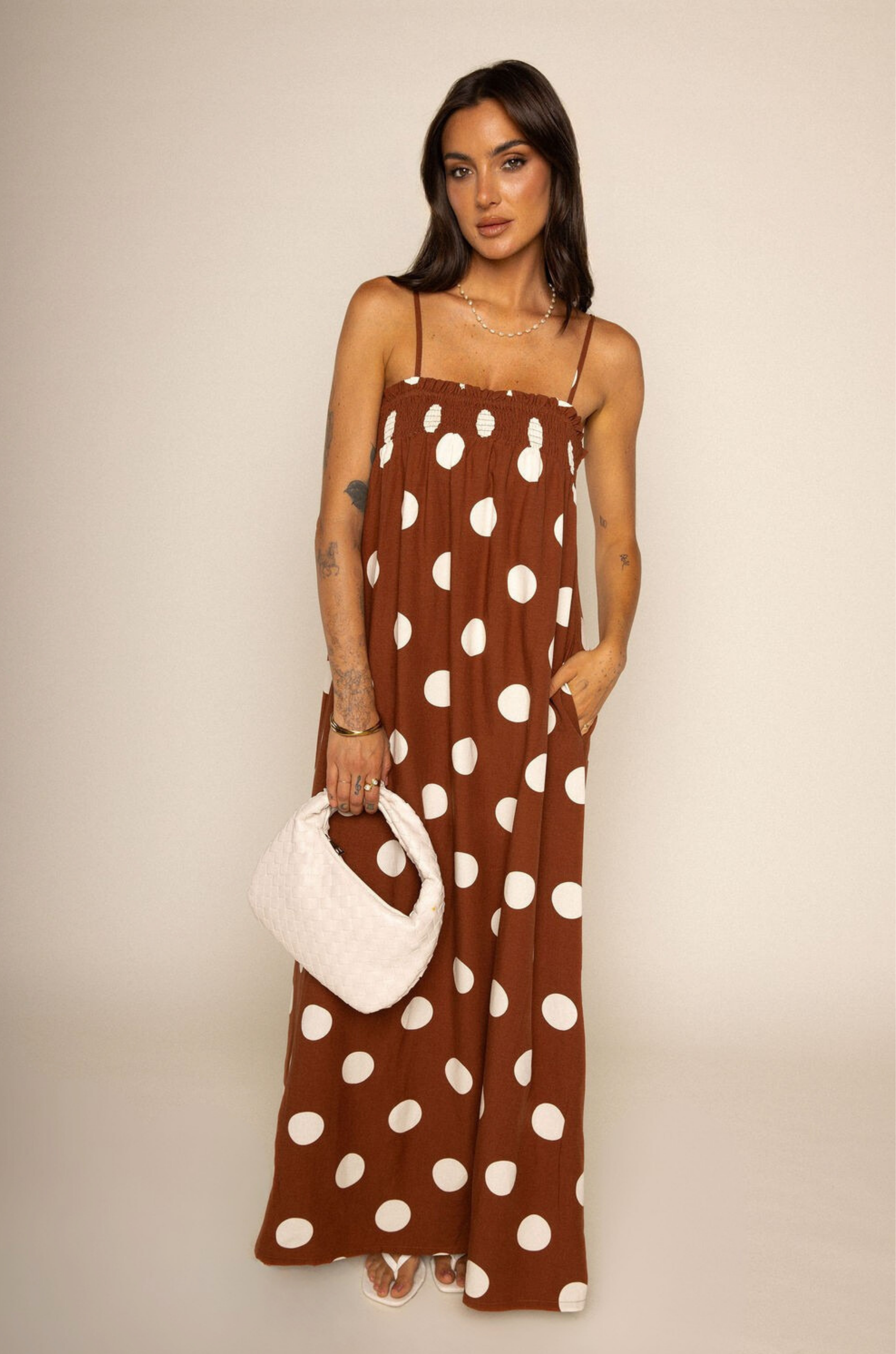 Linen polka dot maxi dress
Side pockets
Adjustable straps
Smocked bust hem
Unlined
brown and white polka dot maxi dress