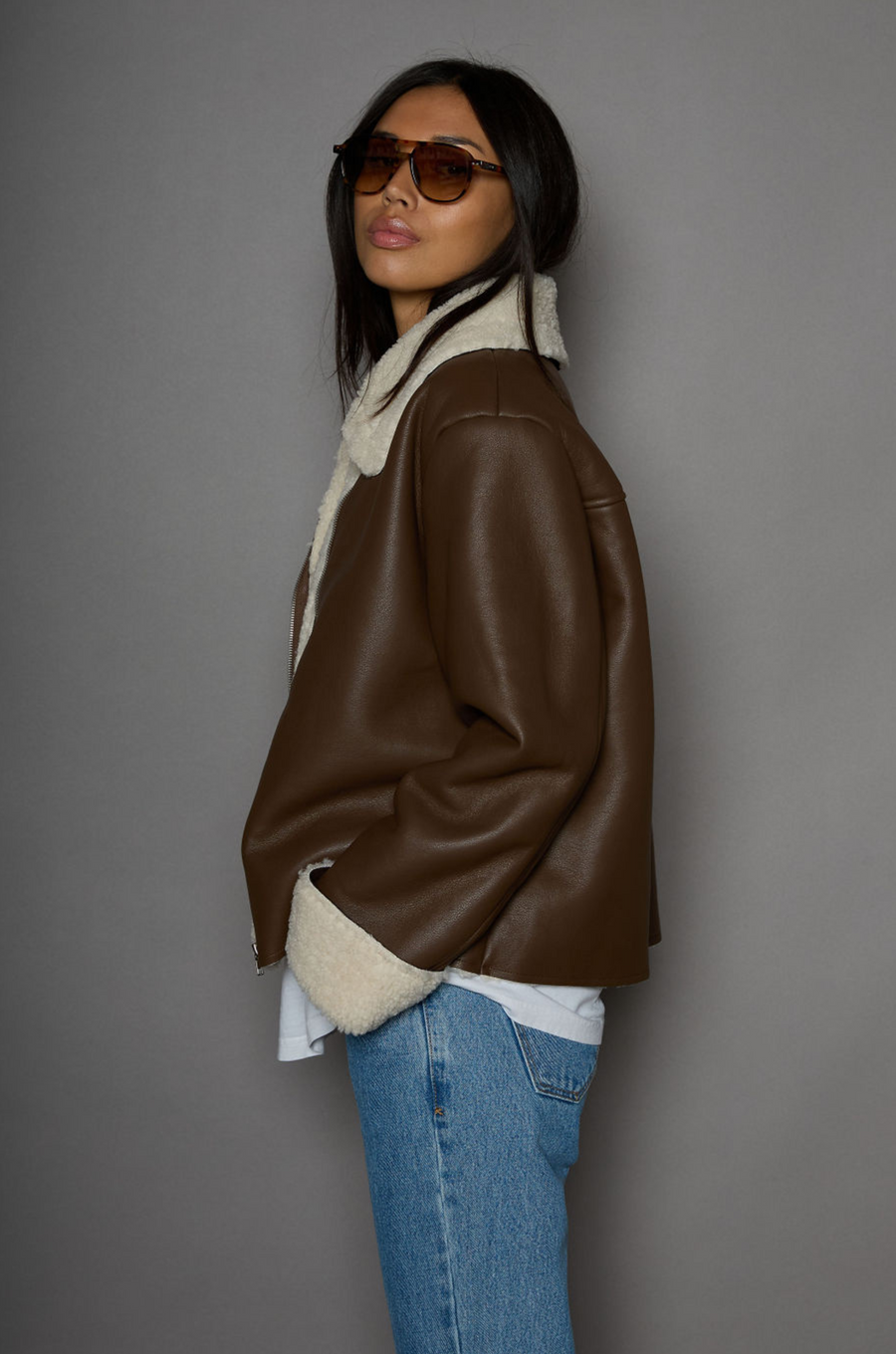 brown Faux leather jacket. Faux Sherpa trim and lining. Front zipper closure. Side pockets. winter jacket. winter coat. fall jacket. fall coat. 