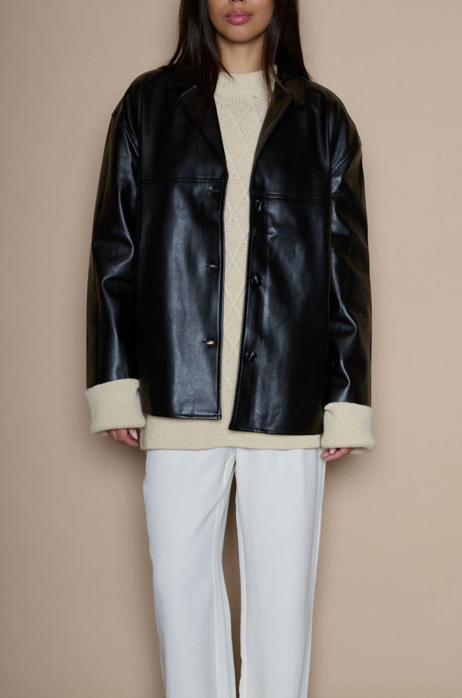Faux leather blazer. faux leather jacket. Single breast. Collar neckline. Front button down closure. Side pockets. Back slit. Fully lined. black leather jacket. black leather blazer. fall jacket. trendy fall jacket. winter jacket. trendy winter jacket