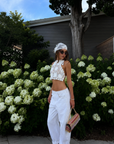 white Open crochet knit halter top
Adjustable neck and back tie
Unlined/Sheer