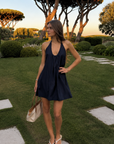navy blue Halter mini dress
Adjustable neck tie
Side pockets
Lined