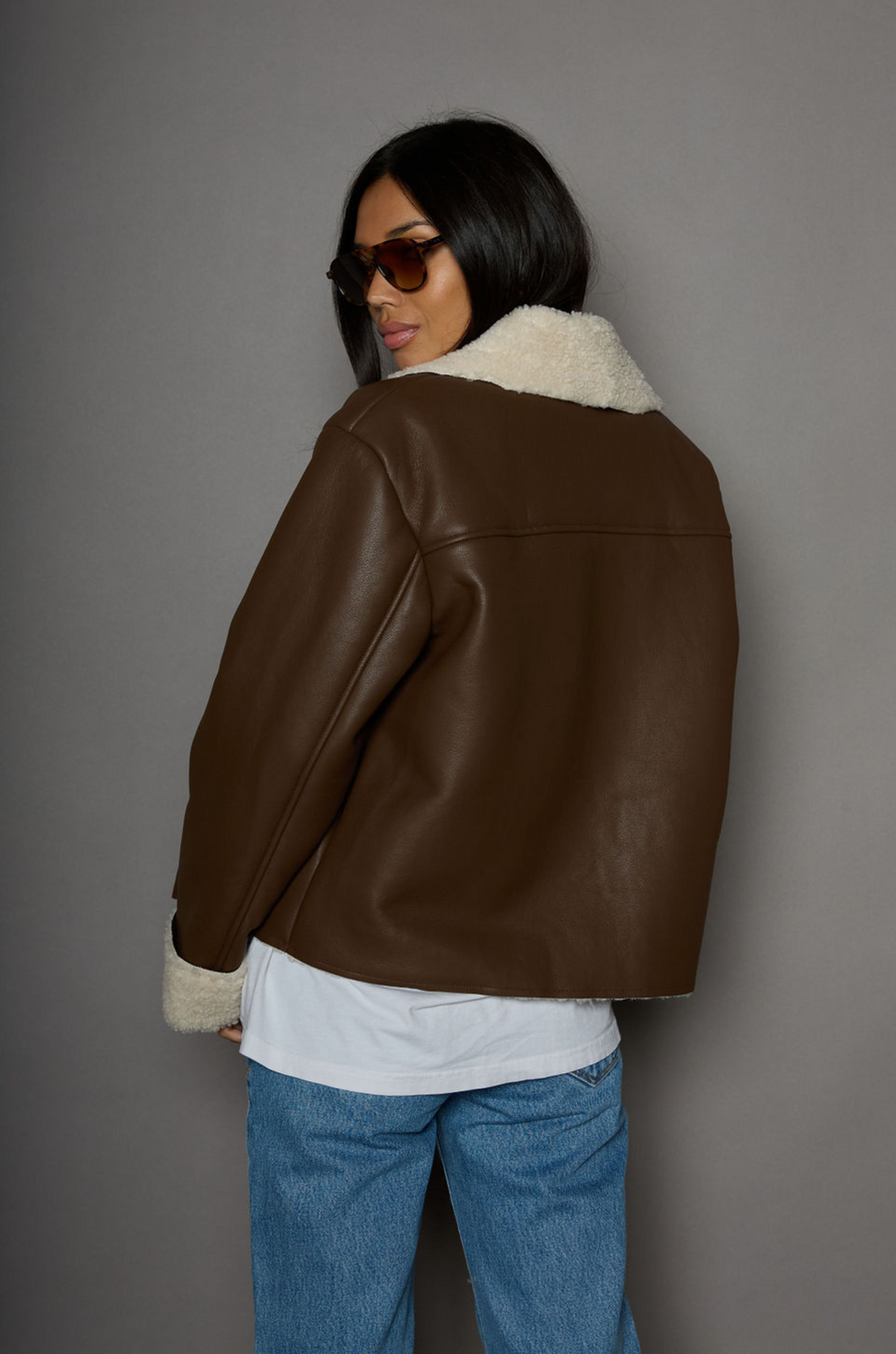 brown Faux leather jacket. Faux Sherpa trim and lining. Front zipper closure. Side pockets. winter jacket. winter coat. fall jacket. fall coat. 