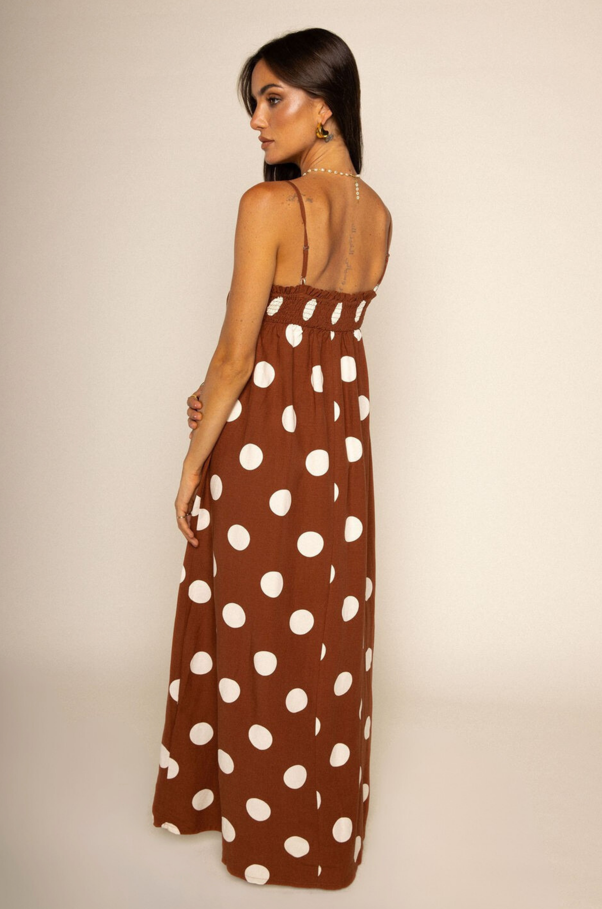 Linen polka dot maxi dress
Side pockets
Adjustable straps
Smocked bust hem
Unlined
brown and white polka dot maxi dress