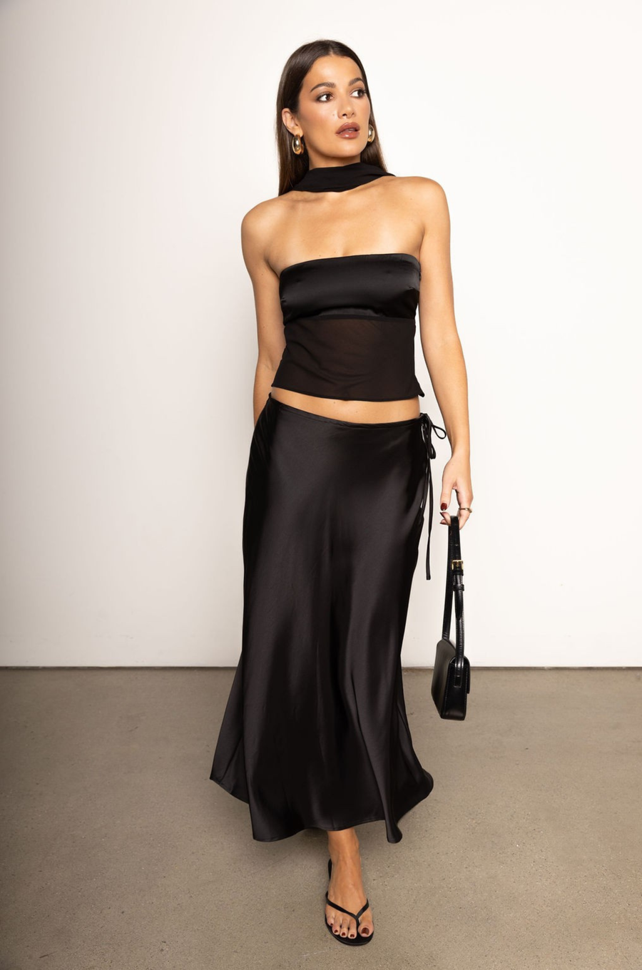 Satin tube top
Partial chiffon bodice
Comes with chiffon scarf
Strapless
Side zipper closure
black satin tube top
holiday outfit
new years top
new years outfit