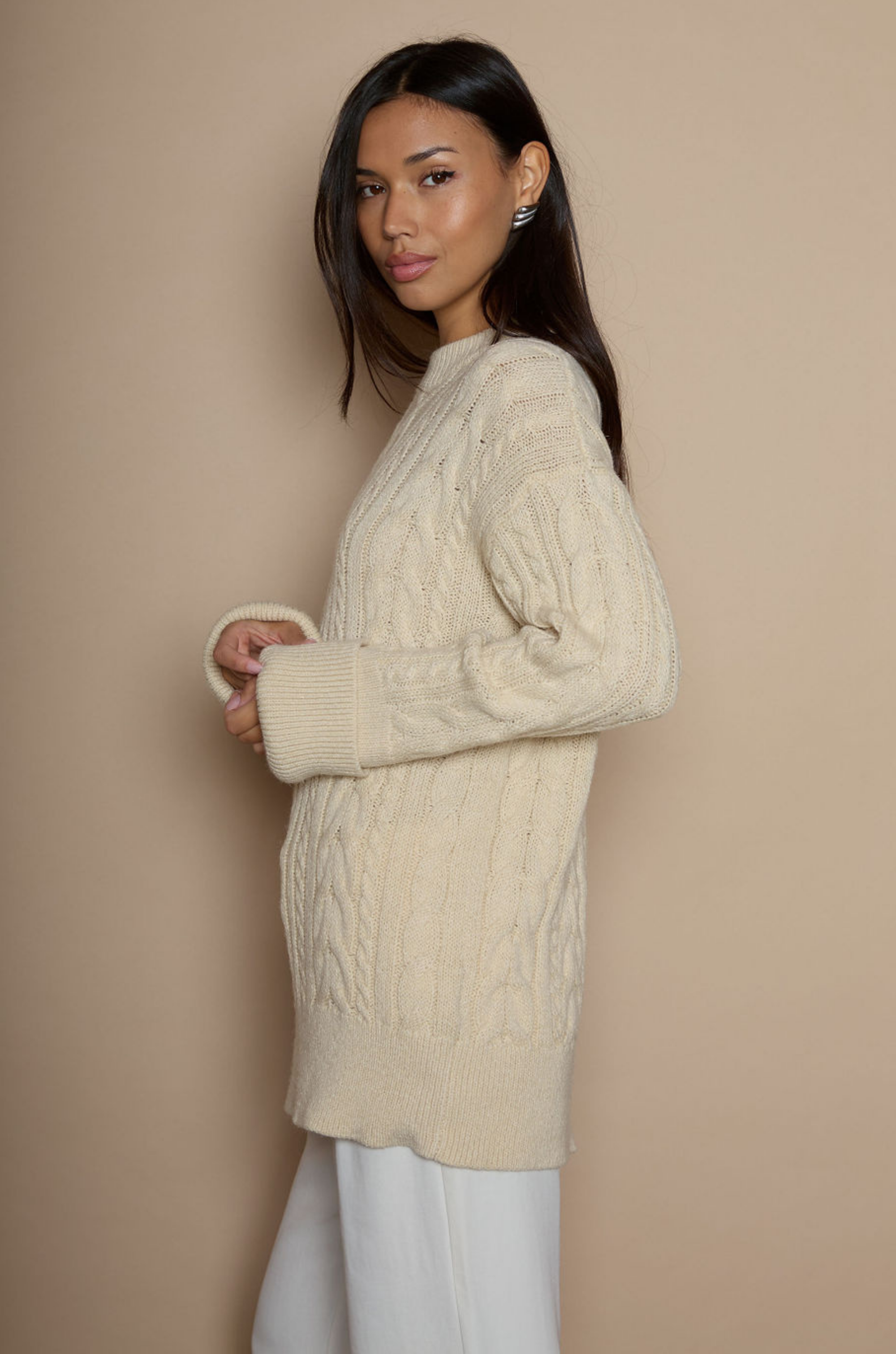 Cable knit sweater dress. Crewneck. Long cuffed sleeves. Unlined. beige sweater dress. fall sweater dress. holiday look