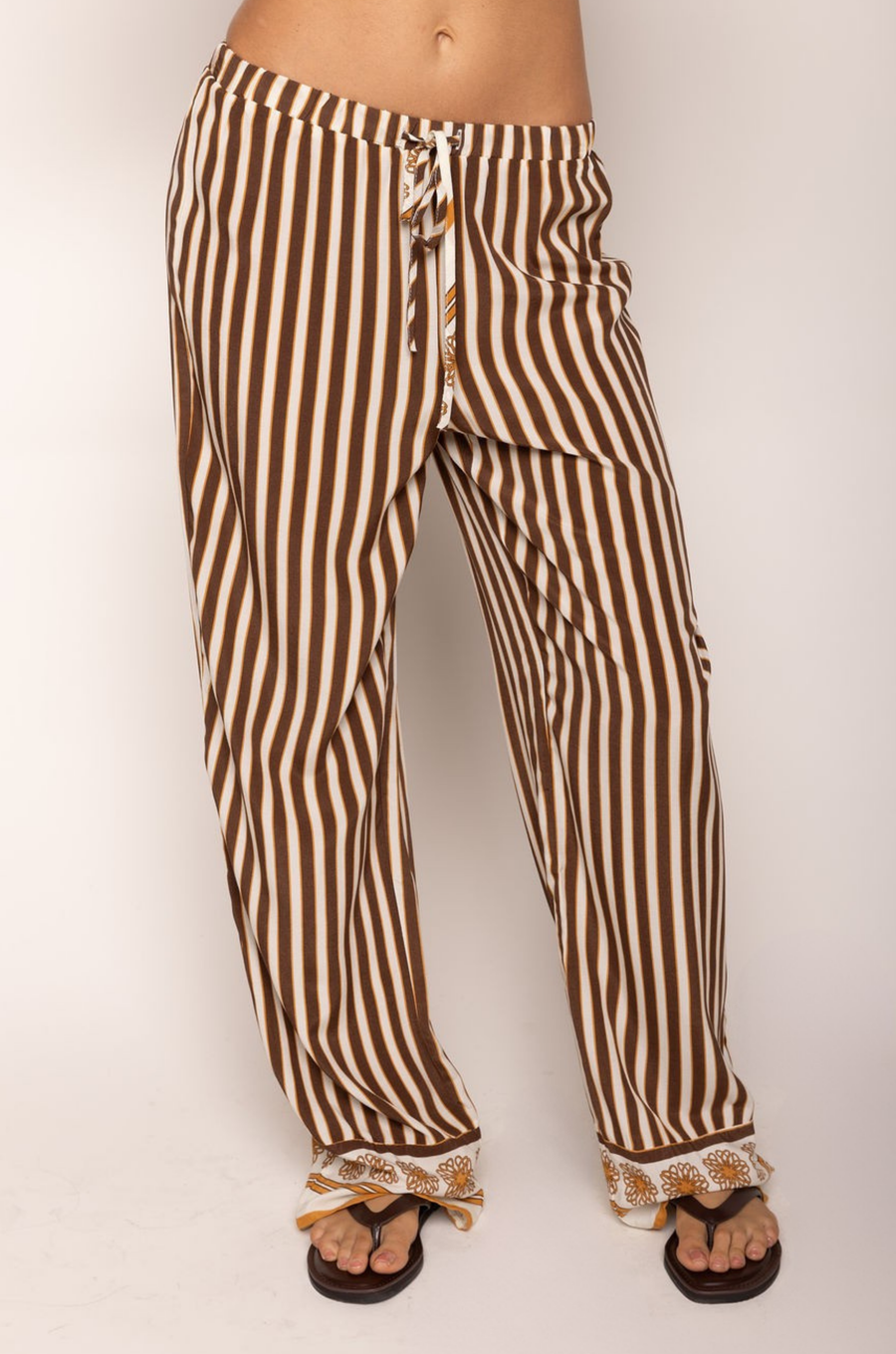 Striped pant
Adjustable drawstring waistband
Unlined
brown and cream striped pant
resort wear pant set
pant swim cover up
