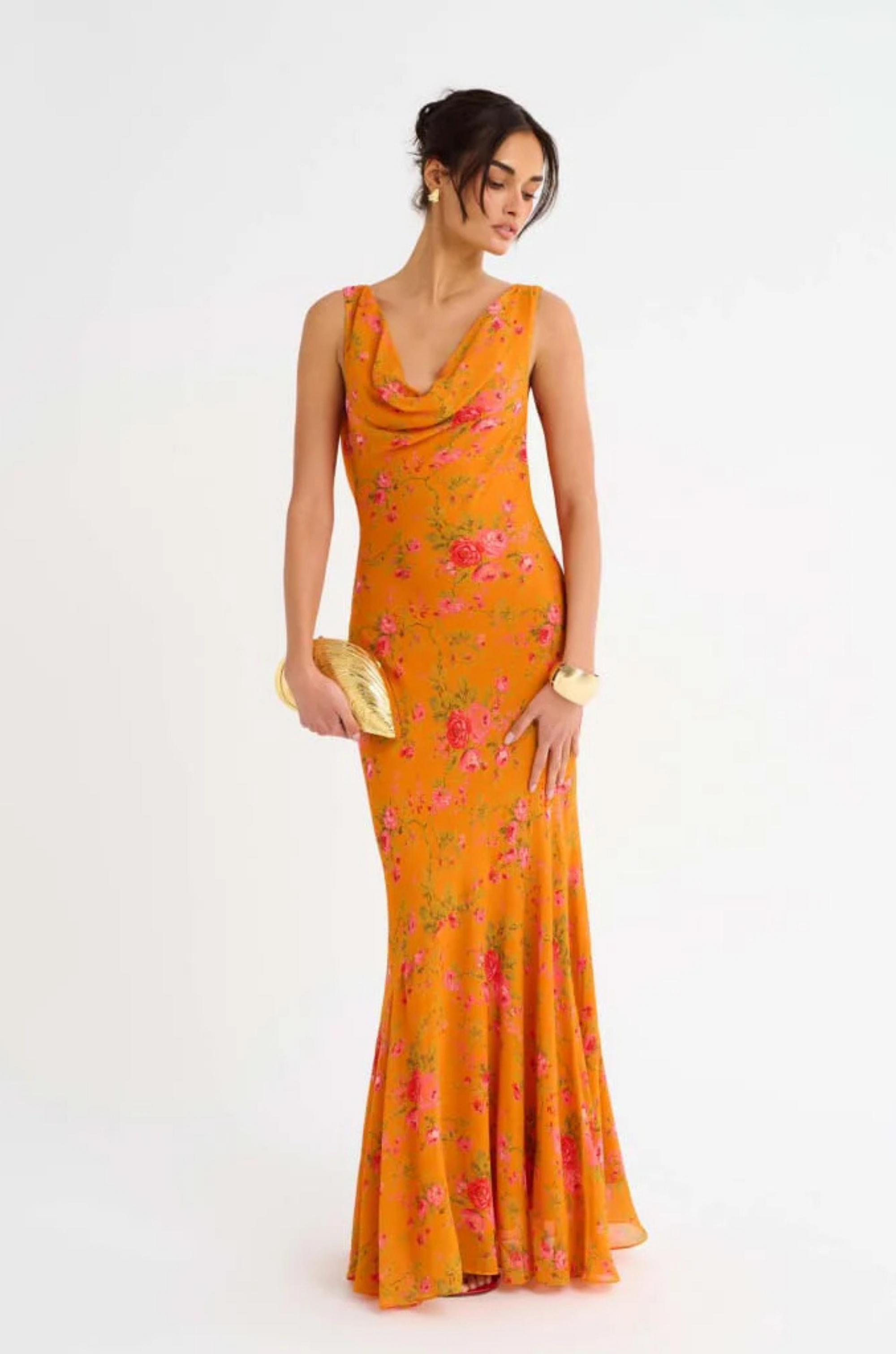 orange Floral printed maxi dress
Cowl neck
Open back with cowl
Adjustable ties at lower back for waist snatching
Mermaid hem
wedding guest dress