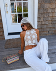 white Open crochet knit halter top
Adjustable neck and back tie
Unlined/Sheer