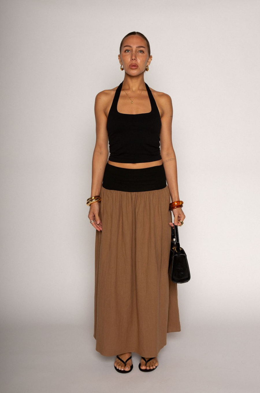 Knit crop top. Elastic halter neckline. Partially lined. going out top. black halter crop top