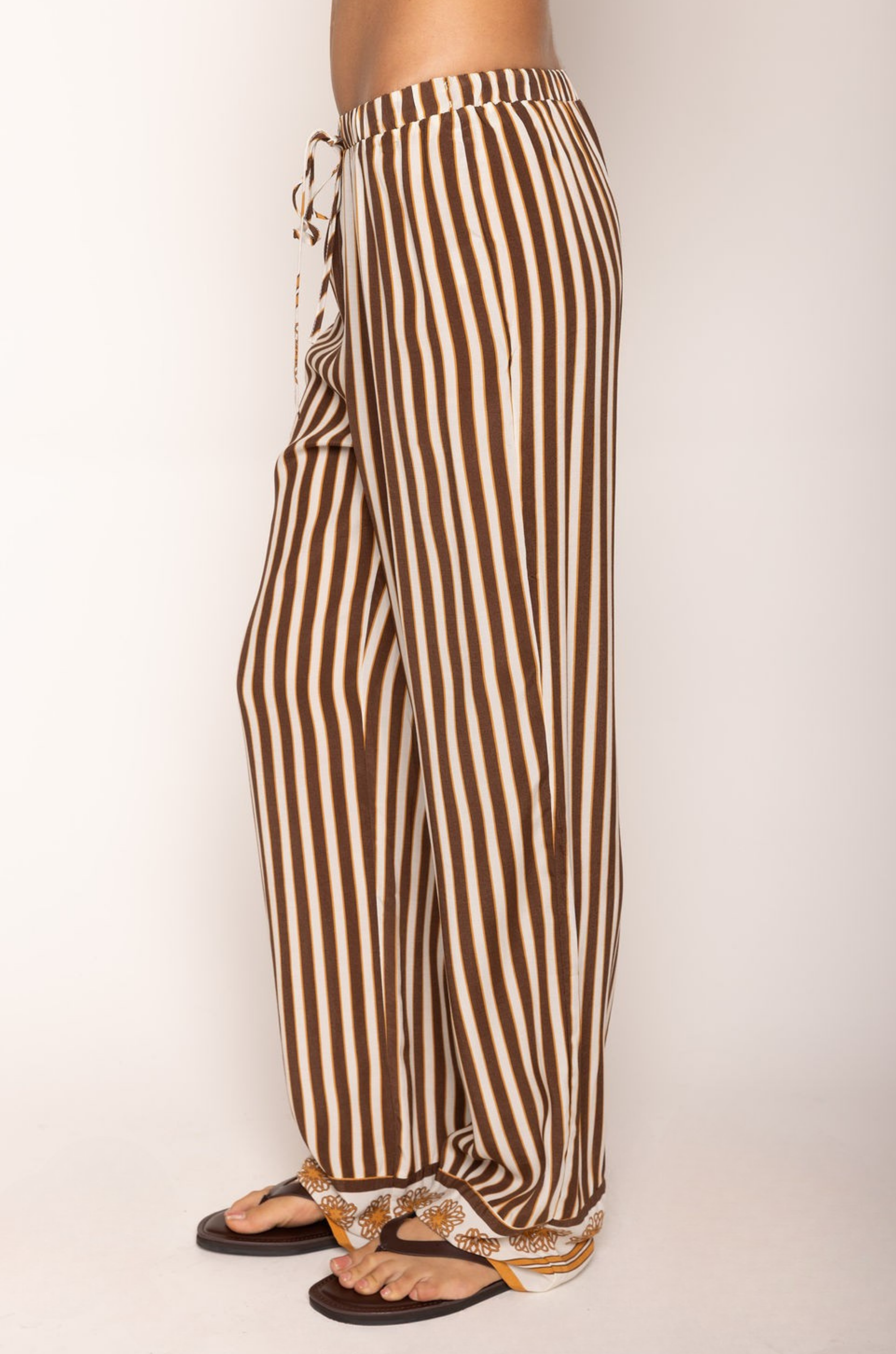 Striped pant
Adjustable drawstring waistband
Unlined
brown and cream striped pant
resort wear pant set
pant swim cover up