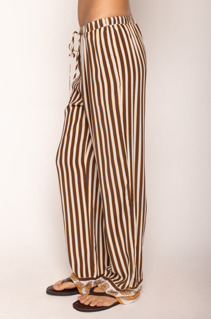 Striped pant
Adjustable drawstring waistband
Unlined
brown and cream striped pant
resort wear pant set
pant swim cover up