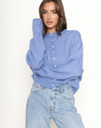 Fuzzy knit cardigan
Crewneck
Front button down closures
Long sleeves
Unlined
blue cardigan