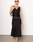 Satin midi skirt
Lace trim
Elastic waistband
Unlined
Partially sheer
black satin midi skirt
frankies dupe