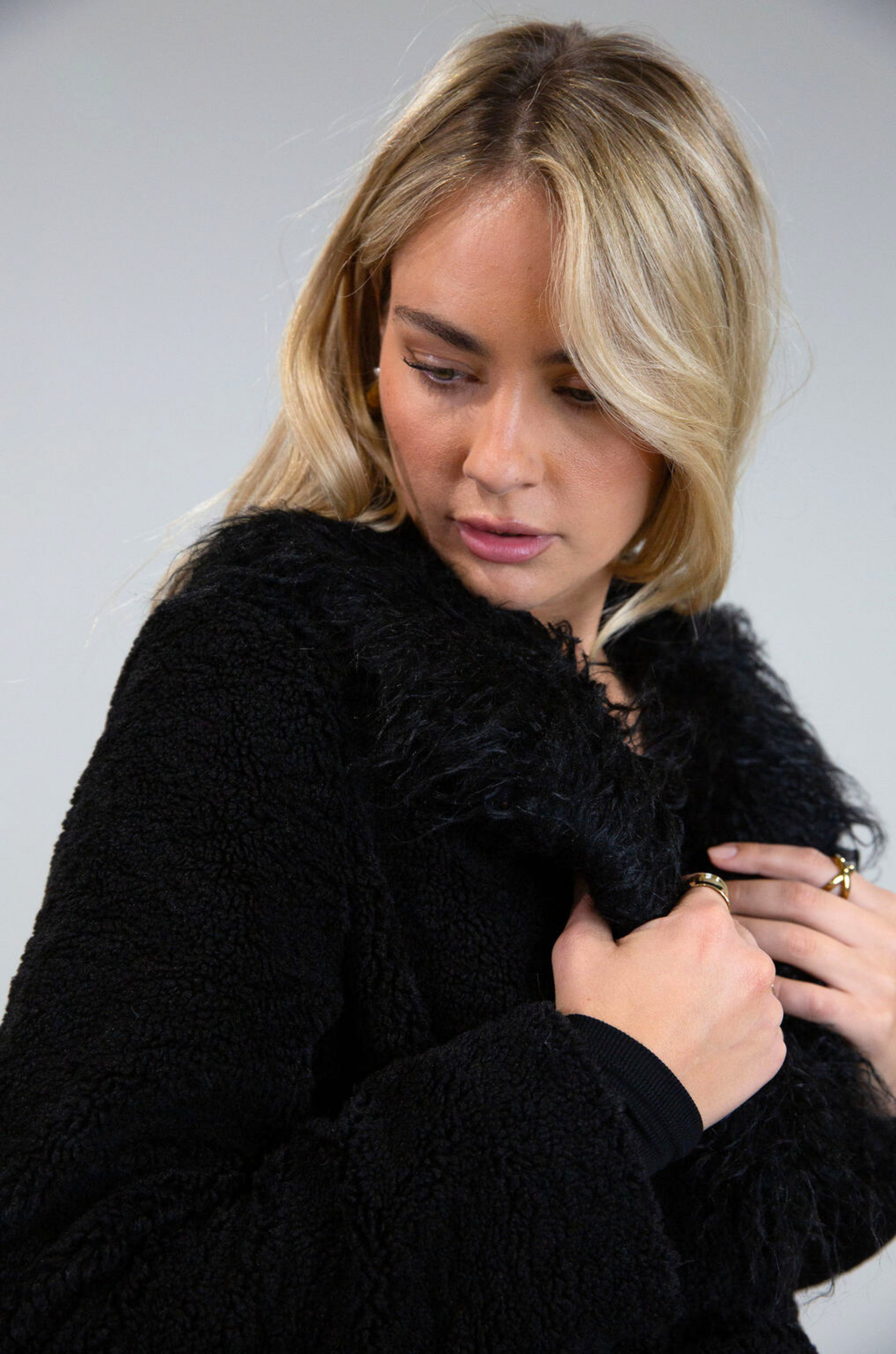 Black Faux sherpa longline coat. Faux fur collar neckline. Front snap button closure. Tie waist. Side pockets. Back slit. Fully lined. long coat. coat for new york. fall coat. fall outfit