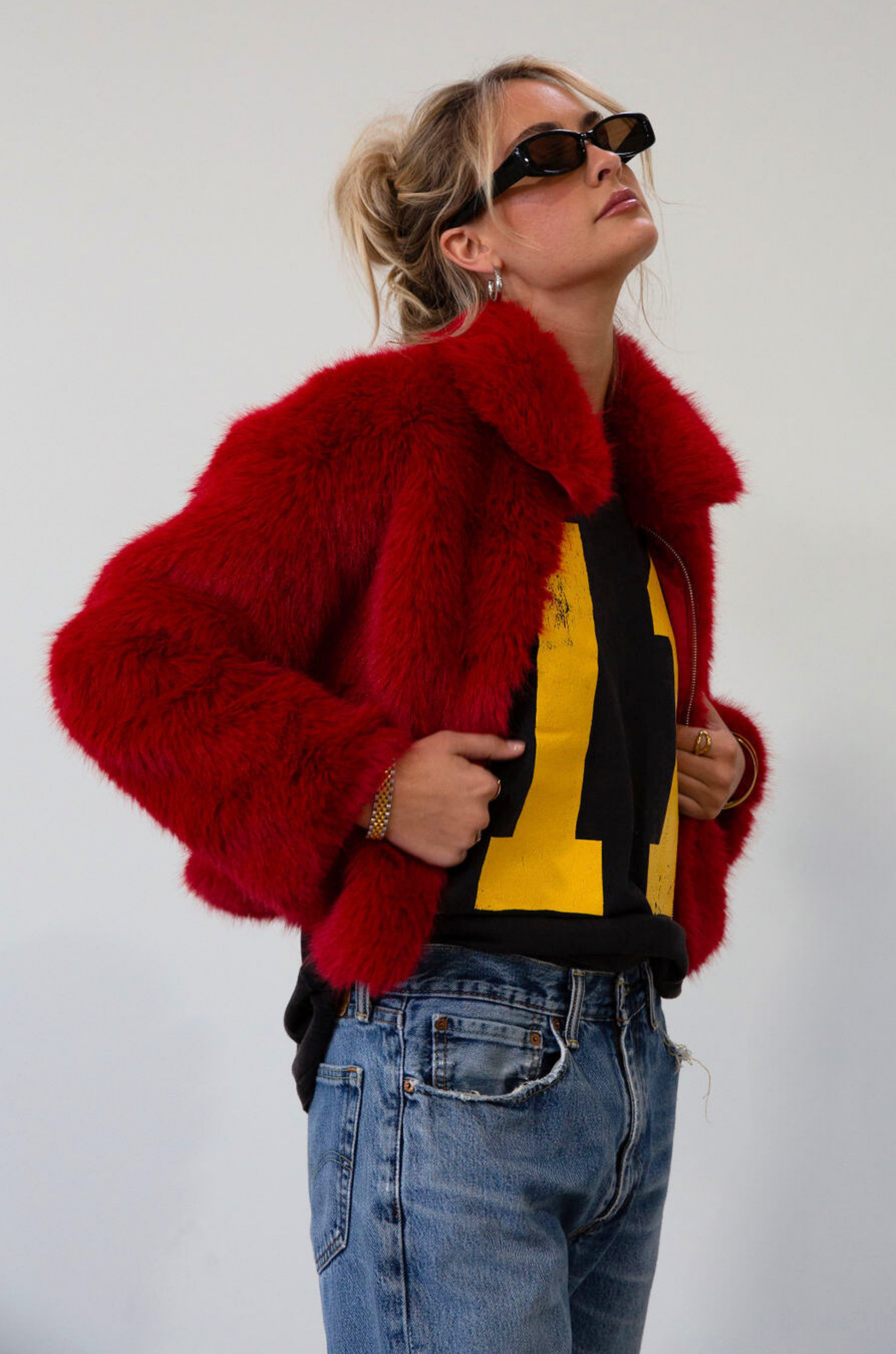 Faux fur coat. Collar neckline. Front zipper closure. Side pockets. Fully lined. red fur coat. fall coat. winter coat. red faux fur coat