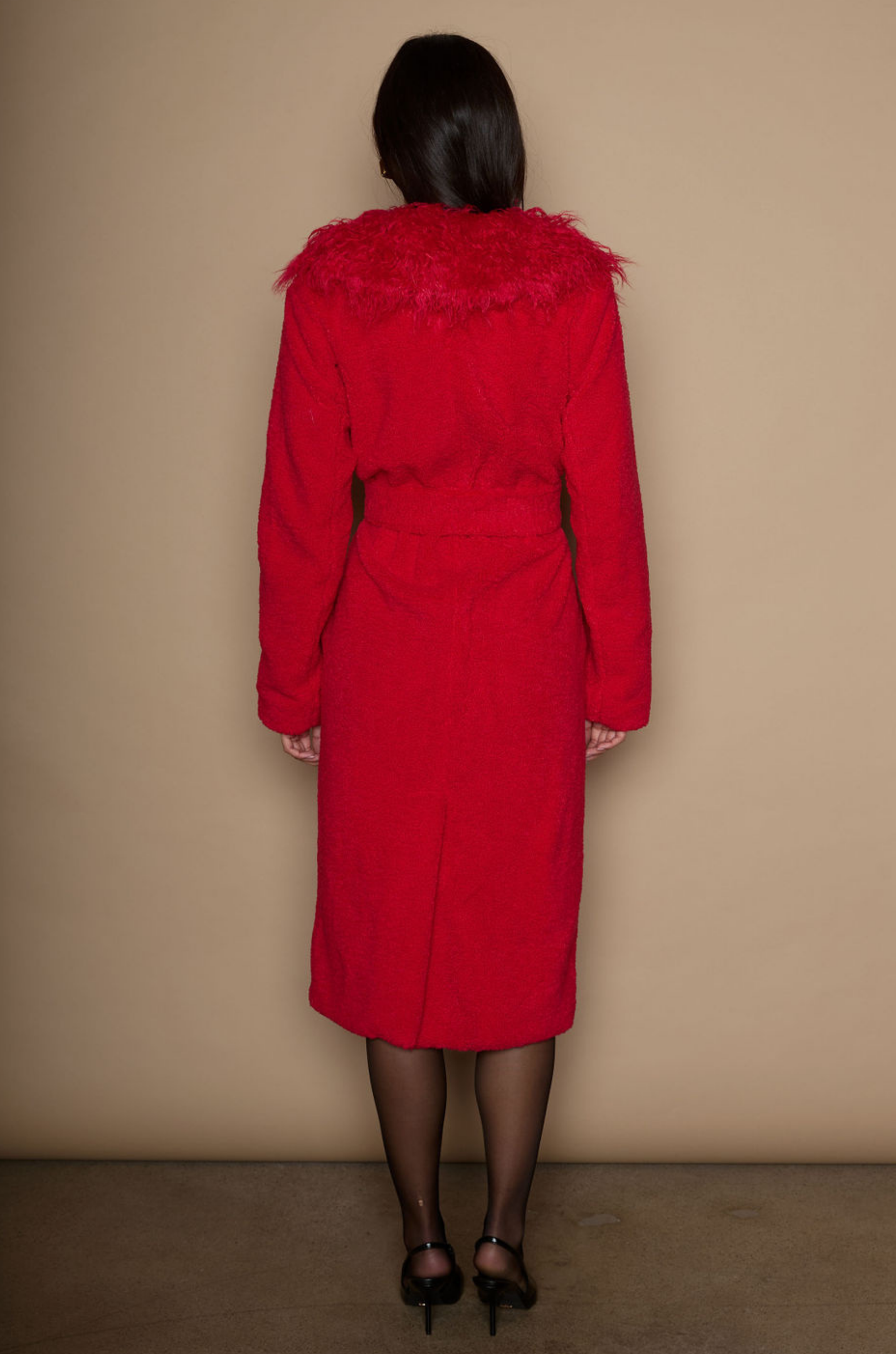 Faux sherpa longline coat. Faux fur collar neckline. Front snap button closure. Tie waist. Side pockets. Back slit. Fully lined. red fur coat. fall outfit. cute winter coat. trendy winter coat.