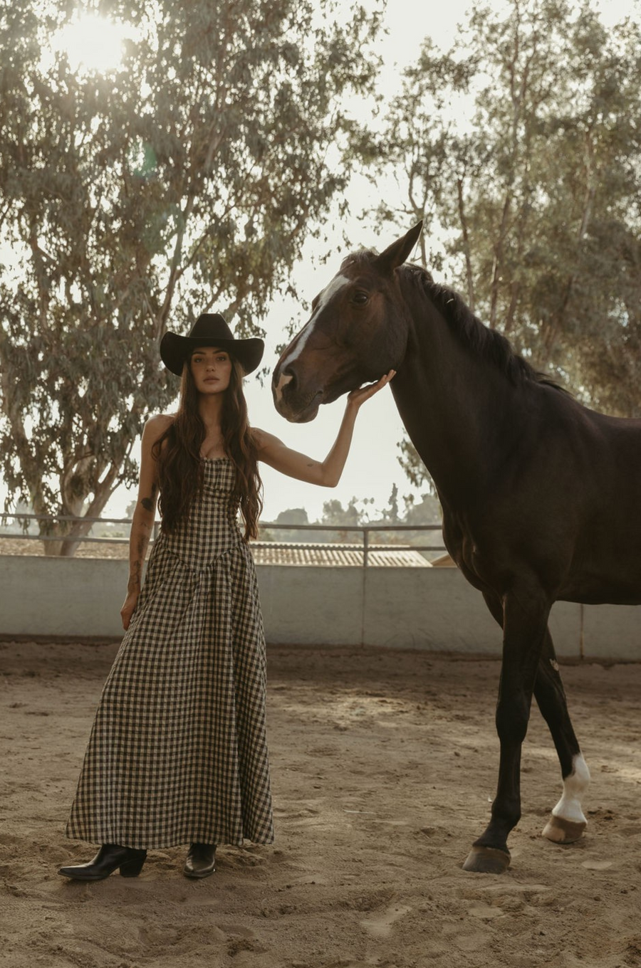 Plaid woven maxi dress. Elastic strapless neckline. Inner rubber grip lining. Elastic smocked back panel. Back hook and eye and zipper closures. Fully lined. Paid maxi dress. ranch outfit. western outfit