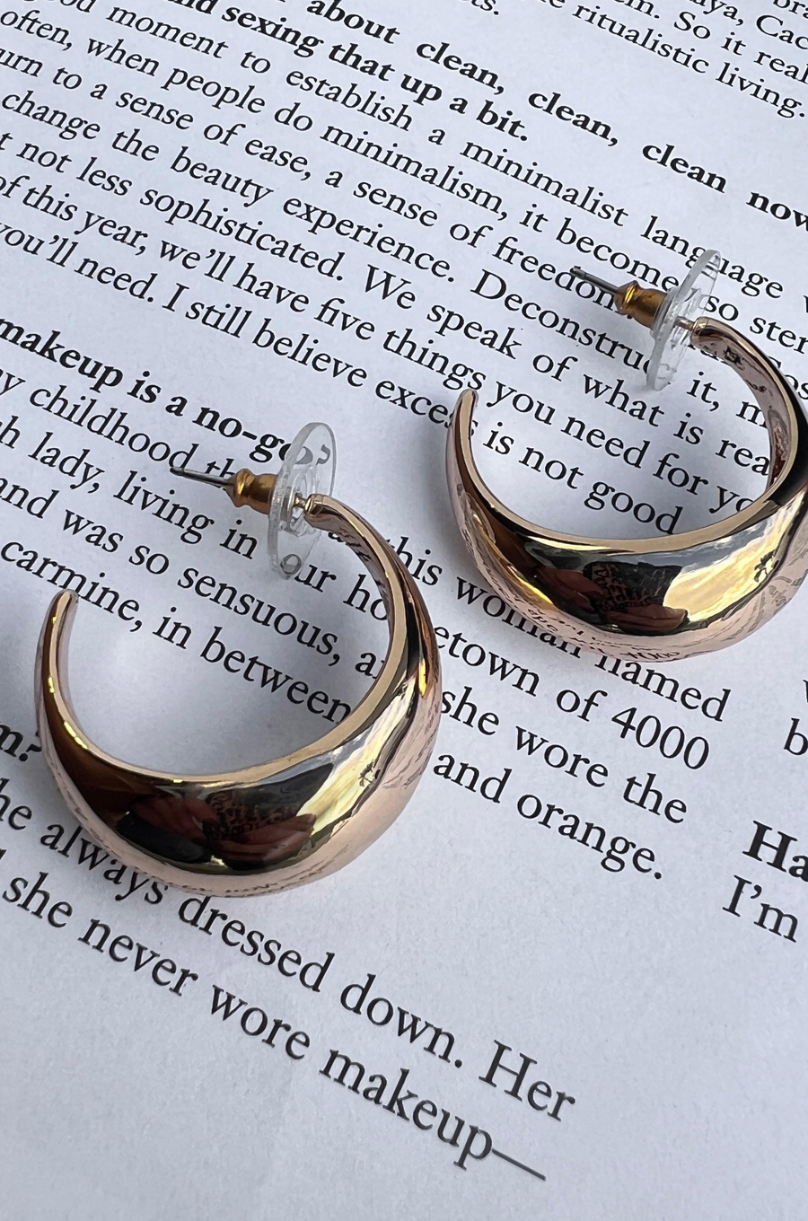 Open hoop gold earrings Post back.