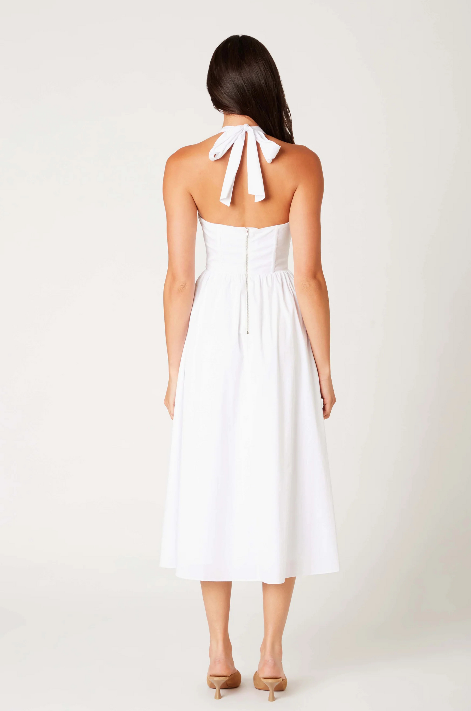 Woven midi dress
Adjustable halter neckline
Boning in bodice
Side pockets
Elastic back neckline
Back hook and eye and zipper closures
Fully lined
white midi dress
bridal dress
bridal shower dress