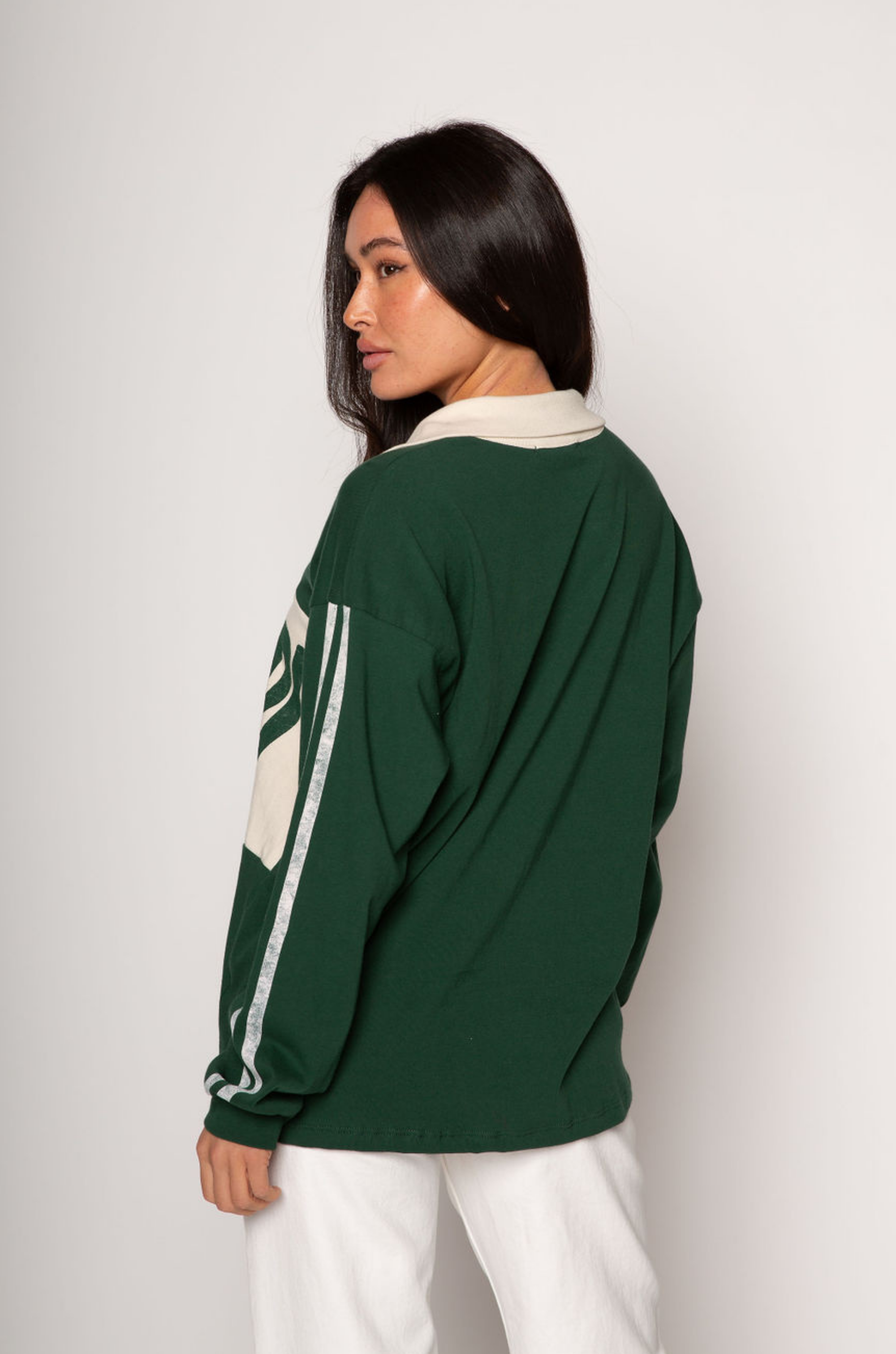 Graphic printed knit top. Collar neckline. Long sleeves. Unlined. green graphic long sleeve tee. bonjour tee