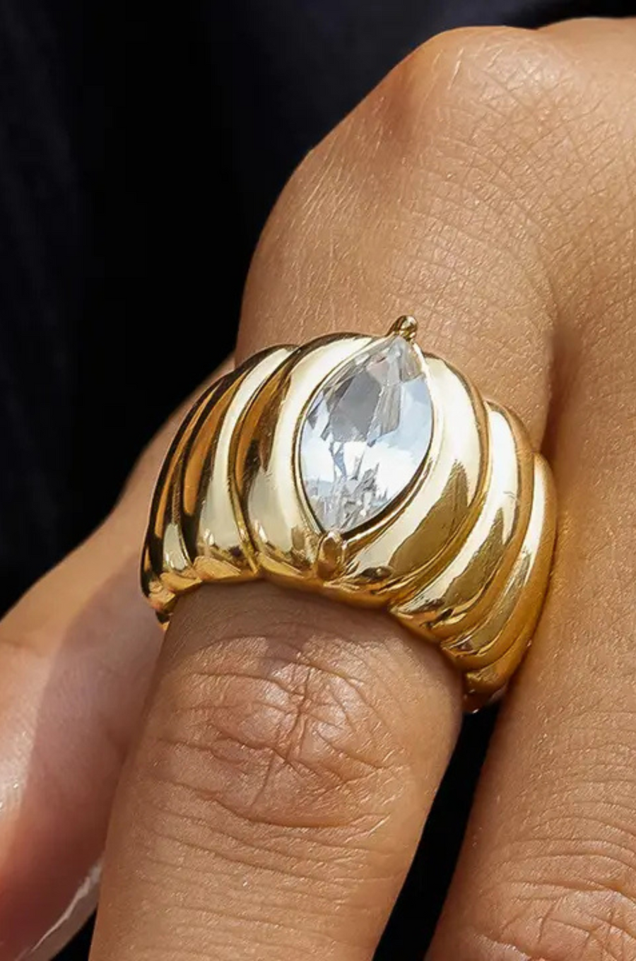 18K Gold Non-Tarnish Marquise
CZ Statement Ring
18K Gold Plating
Stainless Steel
Cubic Zirconia