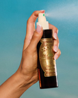 A bottle of Vacation 15 Original Coconut Oil body spray 