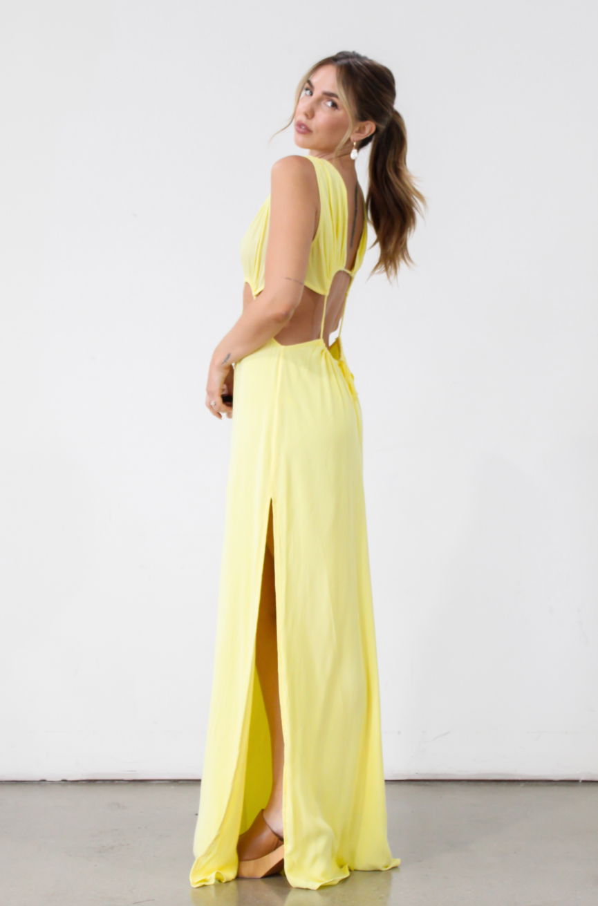 Crinkle woven sleeveless maxi dress. Waist cut outs. Side slits. Back tie closure. Back drawstring waist closure. Partially lined. vacation dress. beach dress. yellow maxi dress. 