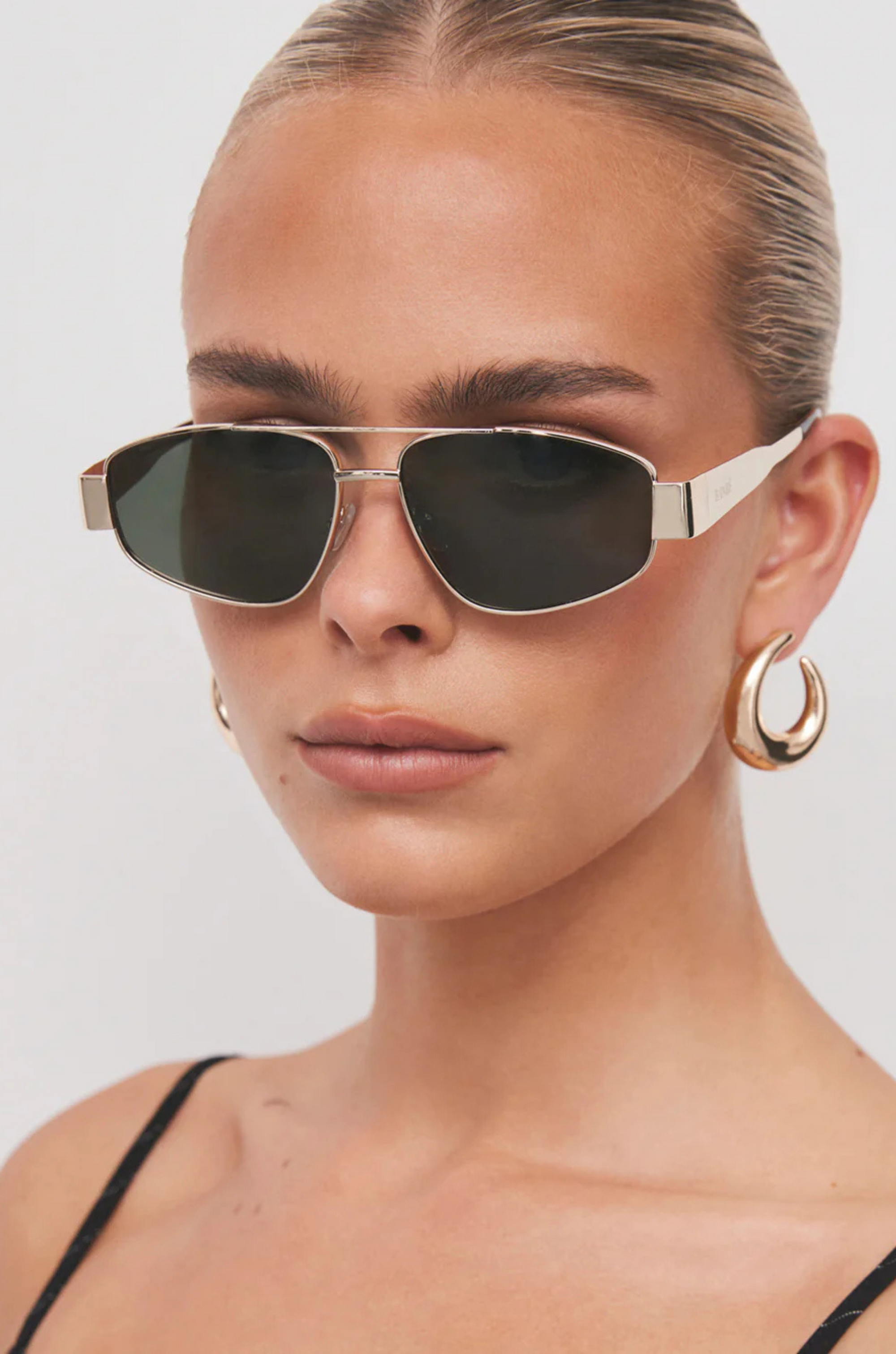 gold black and green Aviator-style sunglasses