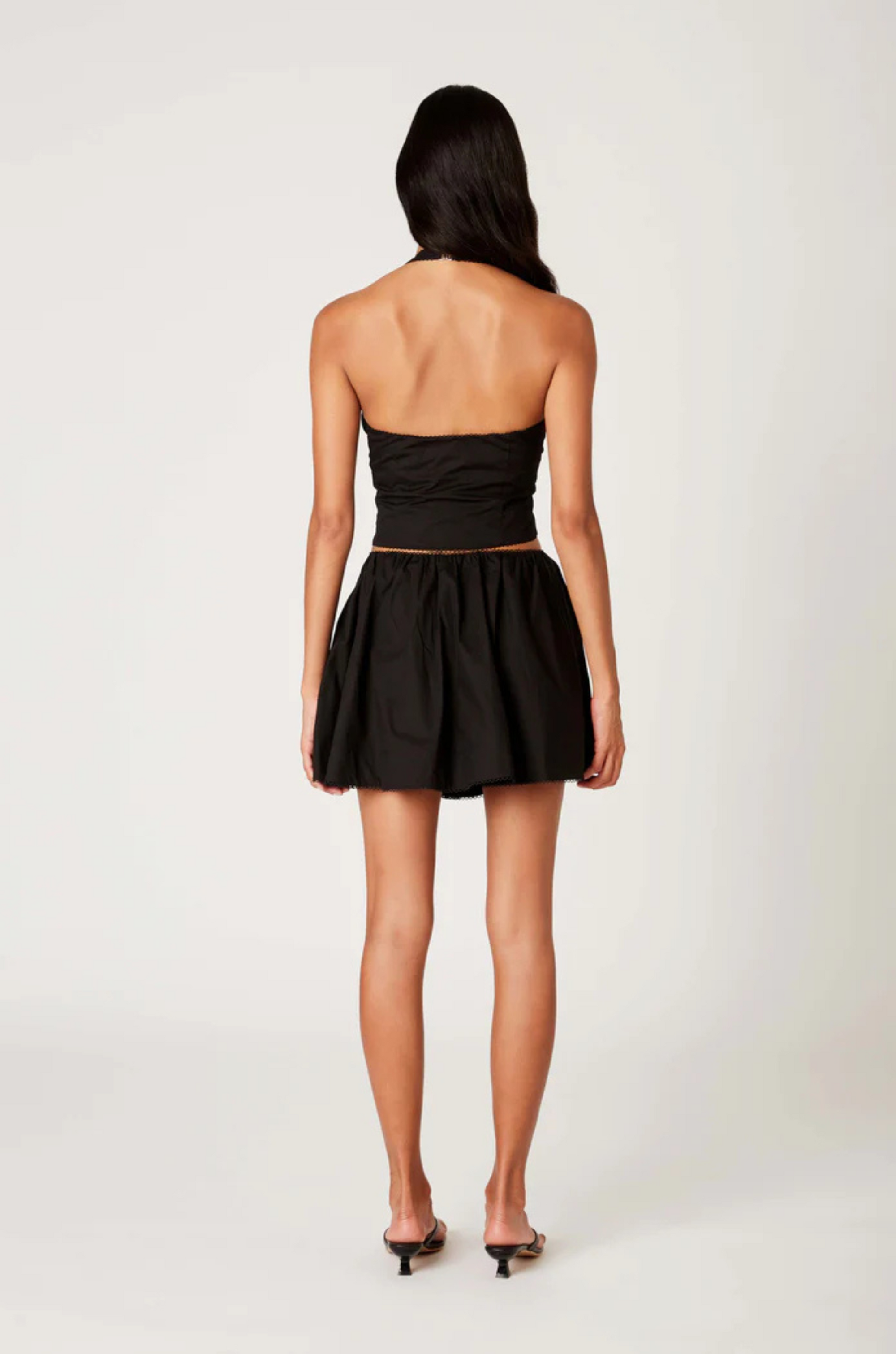 black Poplin halter corset top
Deep V neckline
Scallop edge trim
Hook & eye detail at front
Side zipper closure
Lined