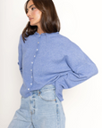 Fuzzy knit cardigan
Crewneck
Front button down closures
Long sleeves
Unlined
blue cardigan