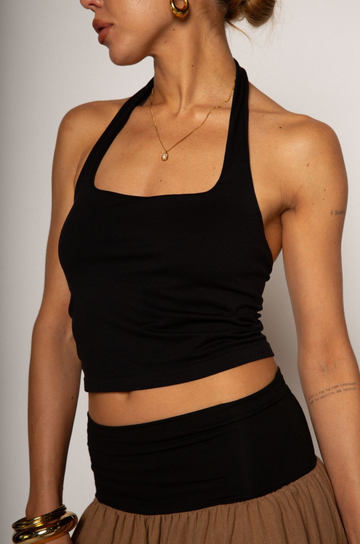 Knit crop top. Elastic halter neckline. Partially lined. going out top. black halter crop top
