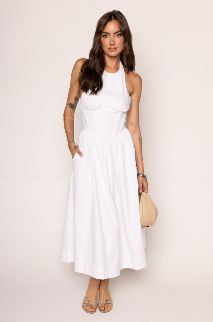 Woven midi dress
Adjustable halter neckline
Boning in bodice
Side pockets
Elastic back neckline
Back hook and eye and zipper closures
Fully lined
white midi dress
bridal dress
bridal shower dress