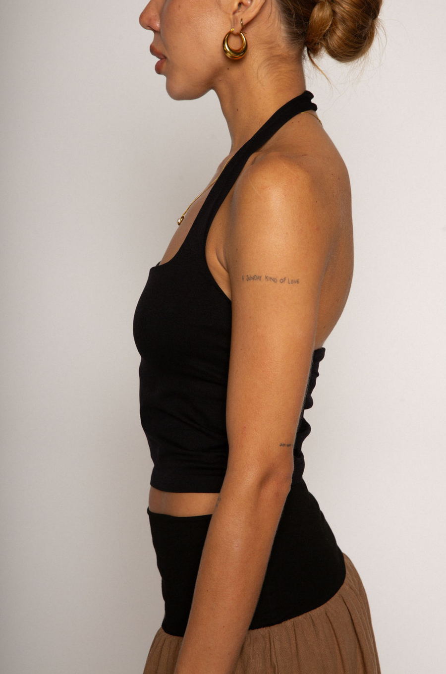Knit crop top. Elastic halter neckline. Partially lined. going out top. black halter crop top