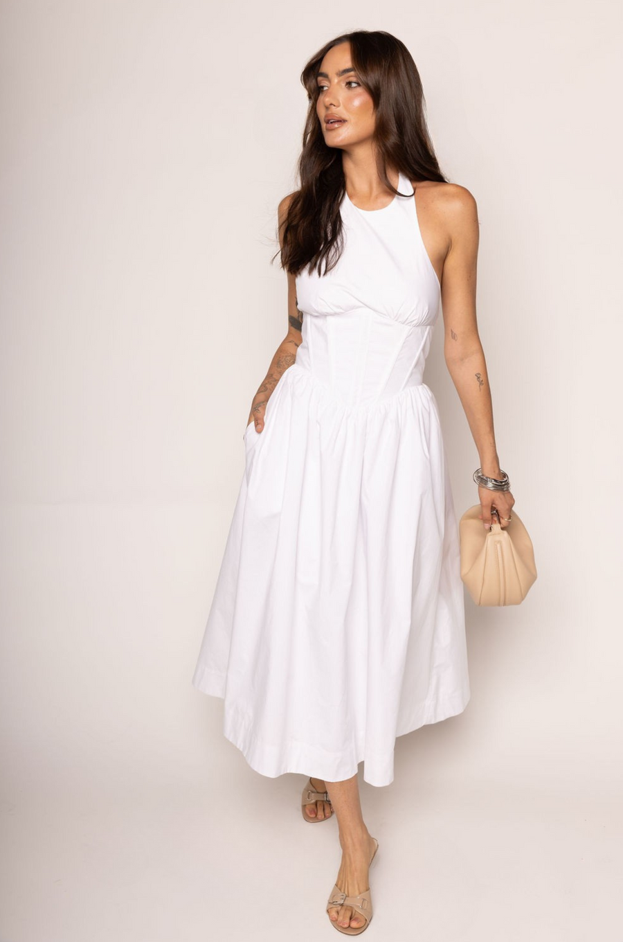 Woven midi dress
Adjustable halter neckline
Boning in bodice
Side pockets
Elastic back neckline
Back hook and eye and zipper closures
Fully lined
white midi dress
bridal dress
bridal shower dress