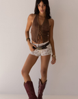 brown Suede halter top
Stud detailing
Front lace up
Fixed neck strap
Open back
Unlined
Length: 21"
Polyester/Spandex
stagecoach outfit
coachella outfit 