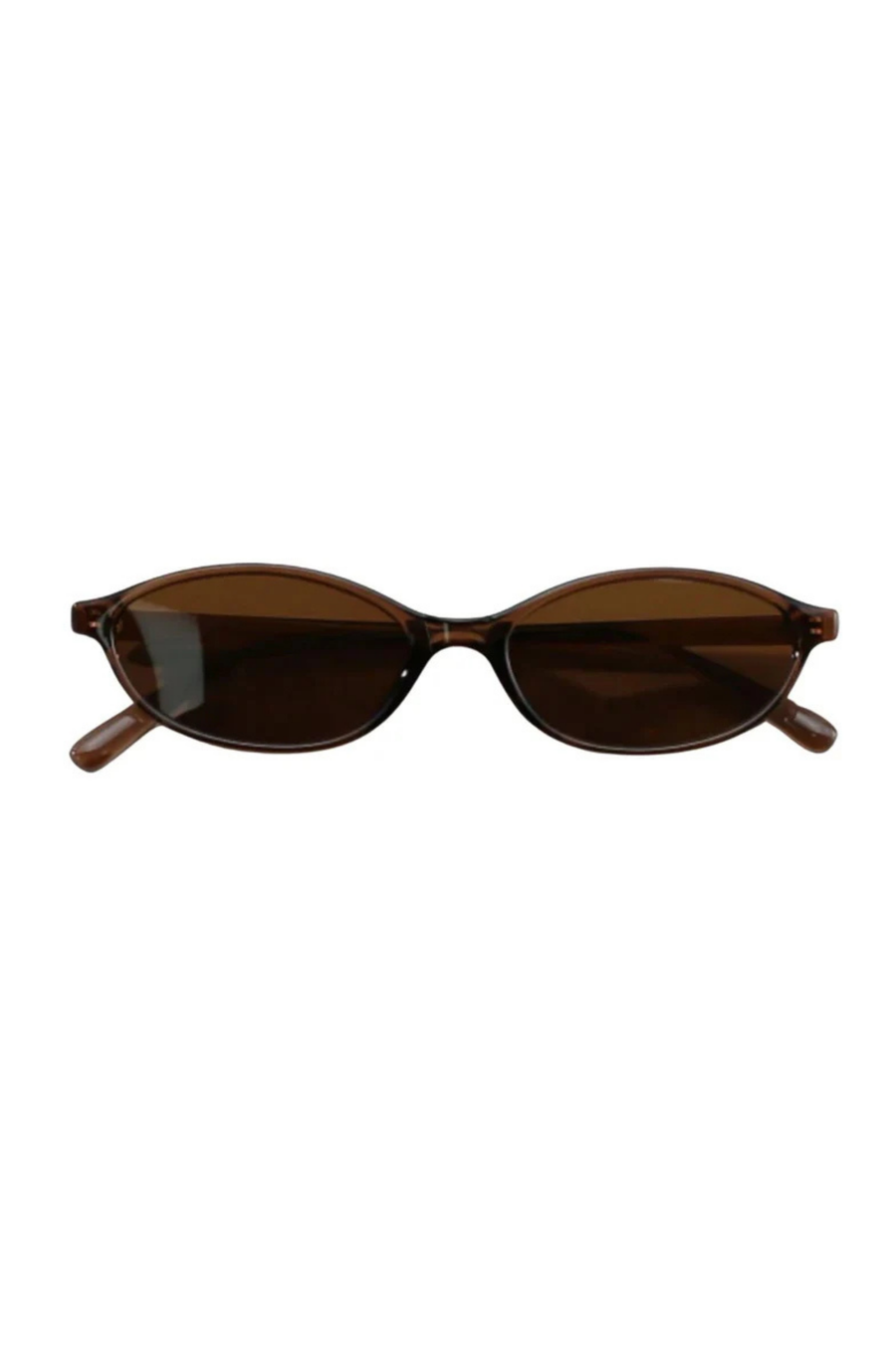 Thin, chic sunglasses
Sleek, minimal, and timelessly refined
Whether you're sipping espresso in the courtyard or hiding behind your shades poolside, they deliver quiet luxury with every glance.
Lightweight and flattering, they’re made for the girl who speaks volumes without saying a word.
thin brown sunglasss